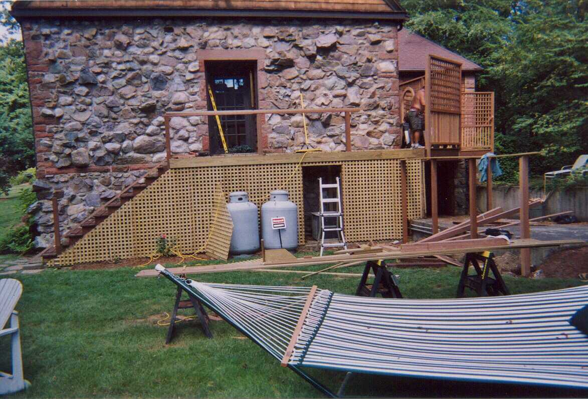 Upper mahogany, gazebo, wood shed, and stockade fence