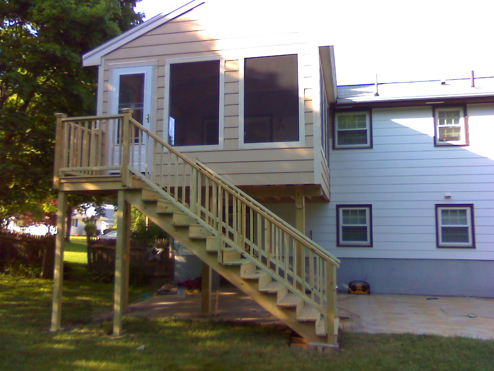 Second-story screened room with outside stair
