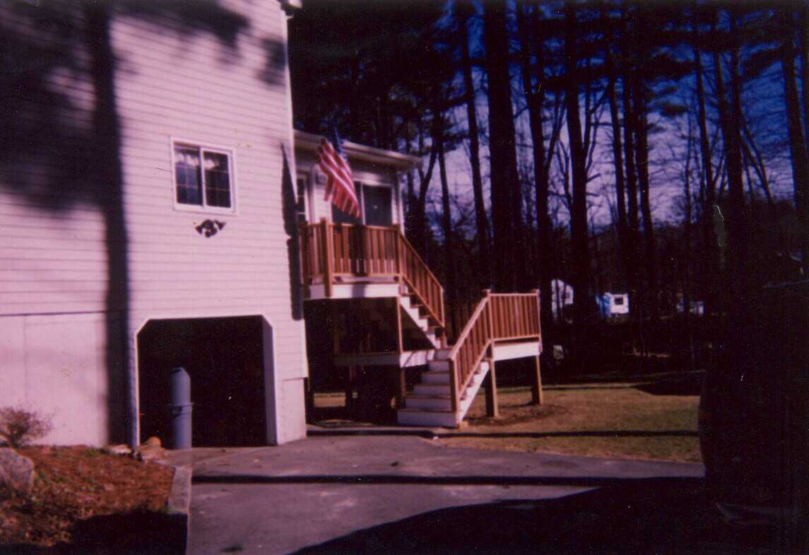 Three season room with mahogany deck and stairs