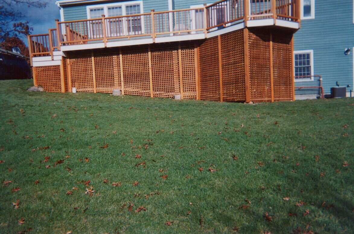 Beautiful mahogany with a bump, stair with turn and square Pressure Treated lattice below.