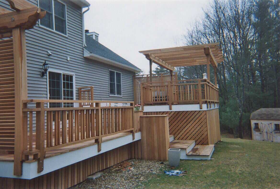 Pergolas, planters, benchwork, custom lattice and decking - all in mahogany