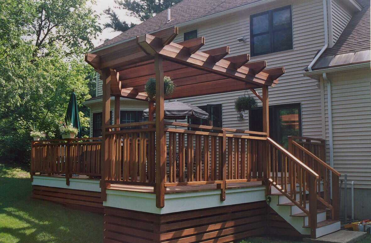 Pergolas, planters, benchwork, custom lattice and decking - all in mahogany