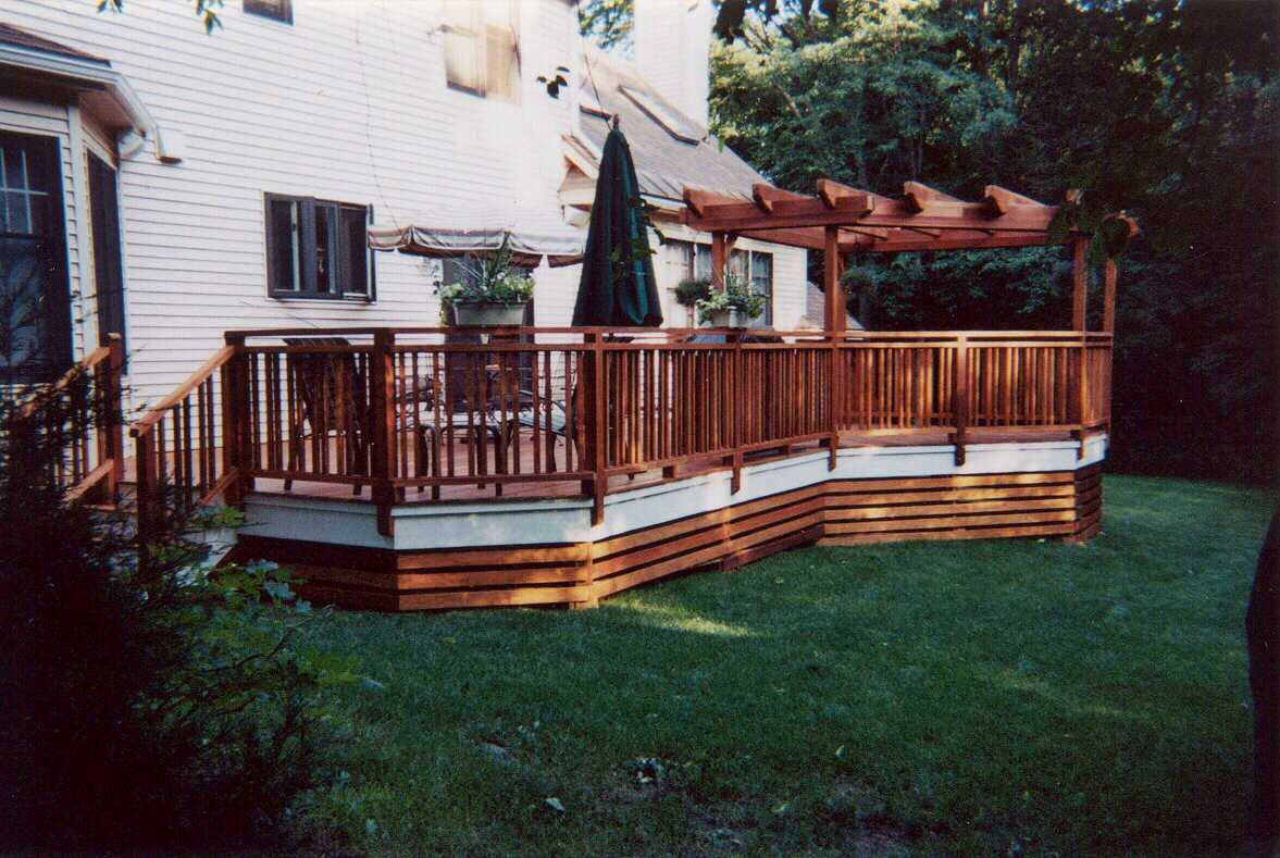 Pergolas, planters, benchwork, custom lattice and decking - all in mahogany