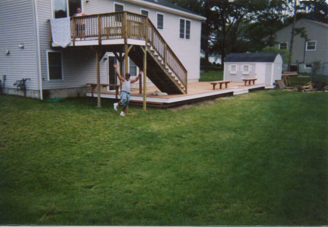 Multi-level with mahogany decking, benches, steps and stairs with granite steps