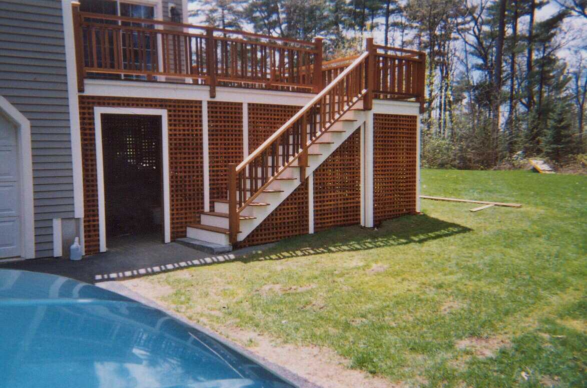 Double top rails with twin balasters and square stained Pressure Treated lattice with access door