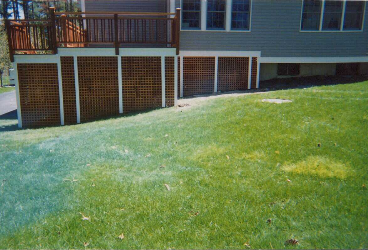 Double top rails with twin balasters and square stained Pressure Treated lattice with access door